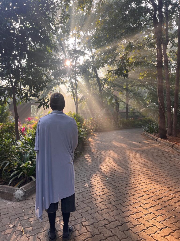 A figure walking toward the morning light